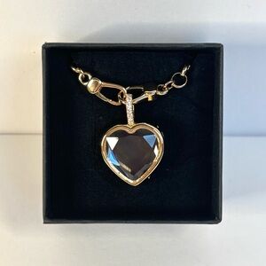 Heart-shaped glass locket (multiple available upon request)